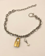 Repurposed LV lock and pearl necklace