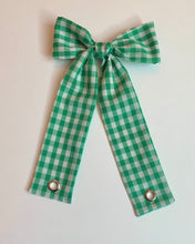 Grommet bow barrette