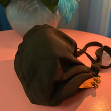 Bolso de mano de latón Faille