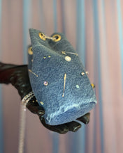 Handmade pierced denim pouch bag