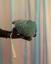 Handmade pierced denim pouch bag