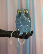 Handmade pierced denim pouch bag