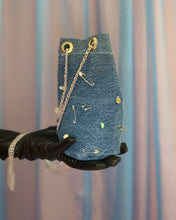 Handmade pierced denim pouch bag