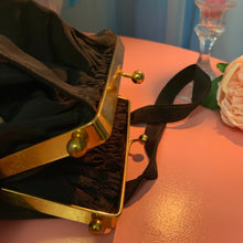 Bolso de mano de latón Faille