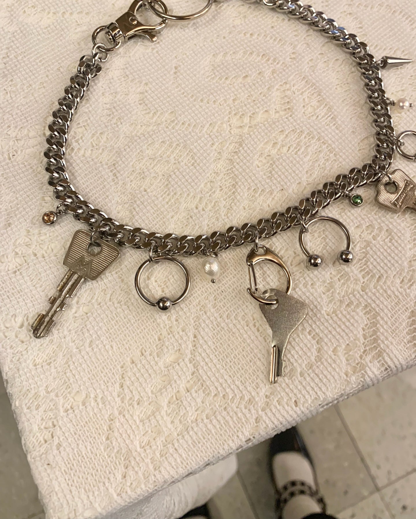 key charm pierced necklace