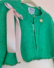 Cropped safety pin bow sweater