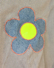 Upcycled vinyl daisy patch skirt