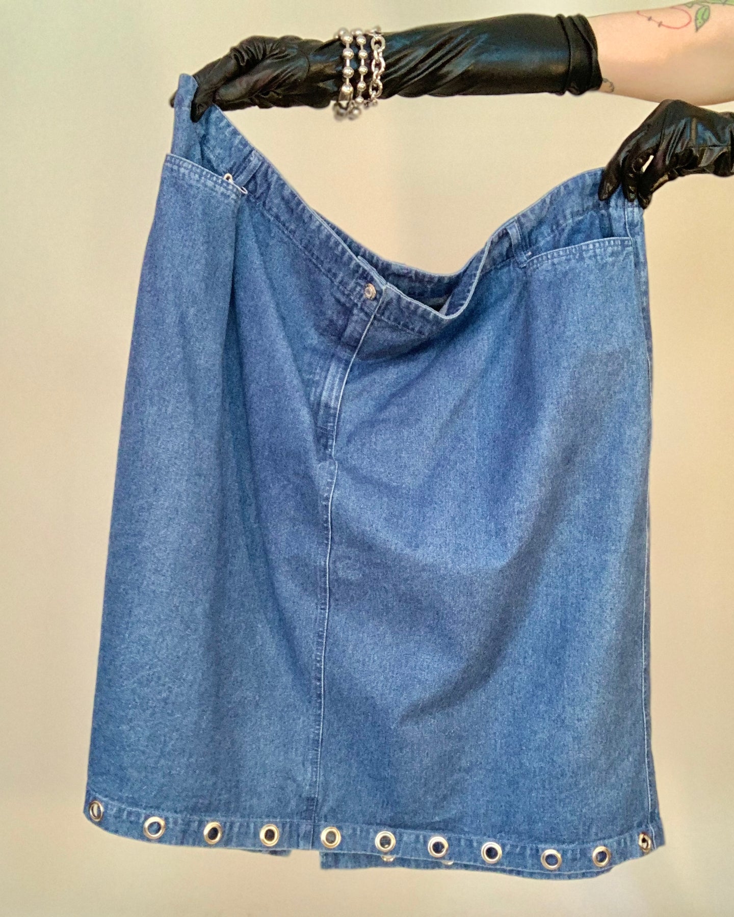 Upcycled grommet hem denim skirt