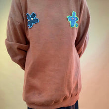 Custom upcycled pierced patch sweatshirt
