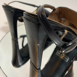 Asymmetrical strap button heels
