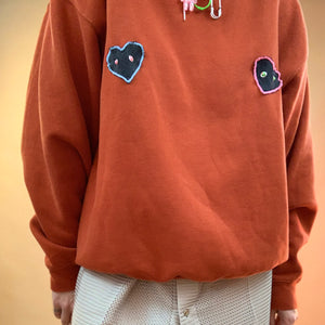 Upcycled pierced heart sweatshirt